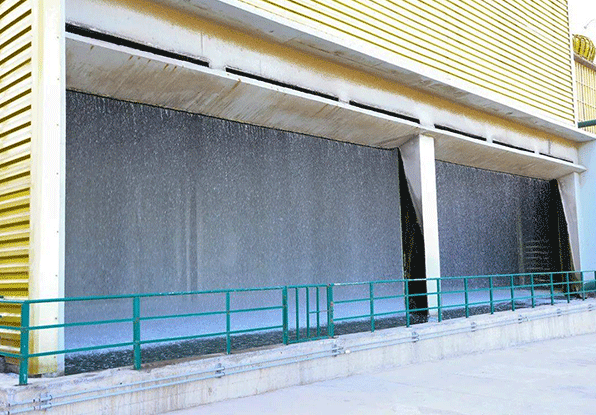 a lot of water dripping at the bottom of a water tower